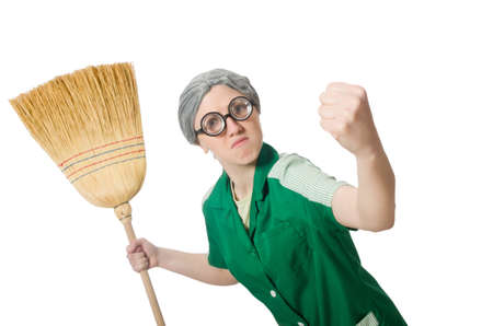 Woman with sweeping brush isolated on whiteの写真素材