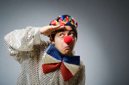 Funny clown against dark backgroundの写真素材