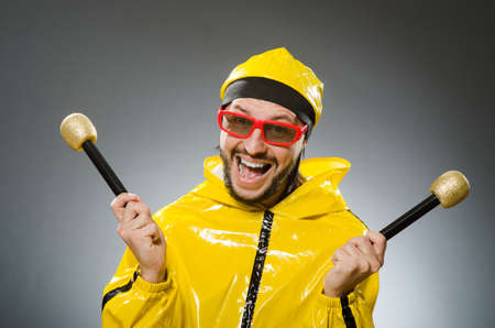 Man wearing yellow suit with mic
