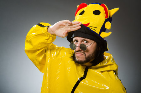 Man wearing yellow suit in funny concept