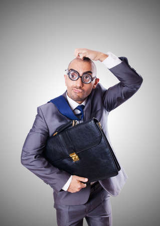 Funny nerd businessman against the gradientの写真素材