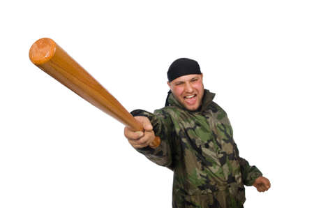 Young man in soldier uniform holding bludgeon isolated on whiteの写真素材