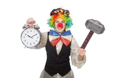 Female clown with alarm-clock and hammer isolated on whiteの写真素材