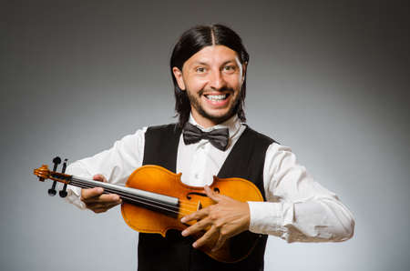 Man playing violin in musical conceptの写真素材