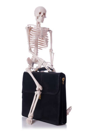 Skeleton with suitcase isolated on whiteの写真素材