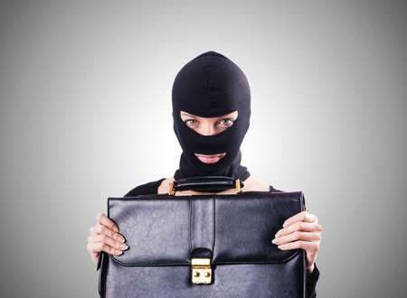 Industrial espionage concept with person in balaclava