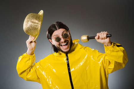 Man wearing yellow suit with mic