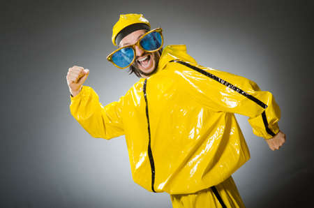 Man wearing yellow suit in funny concept