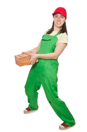 Woman holding clay brick isolated on whiteの写真素材