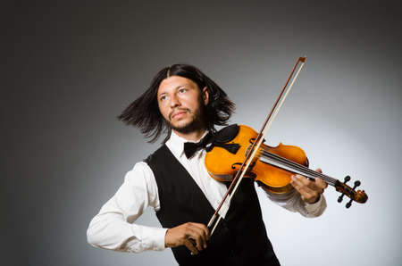 Man playing violin in musical conceptの写真素材