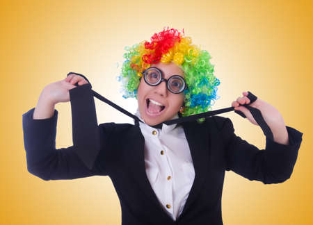Woman clown businesswoman isolated on whiteの写真素材