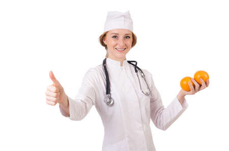 Pretty female doctor with stethoscope isolated on whiteの写真素材