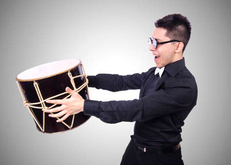 Funny man with drum on whiteの写真素材