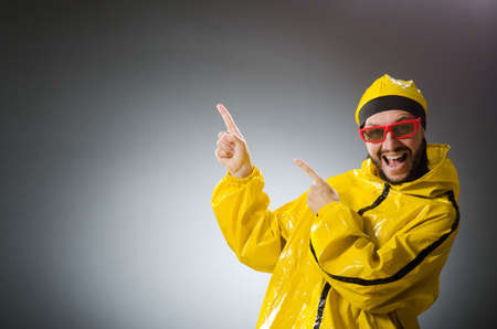 Funny man wearing yellow suitの写真素材