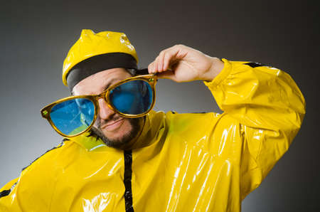 Man wearing yellow suit in funny conceptの写真素材