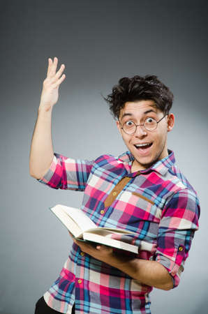 Funny student with many booksの写真素材