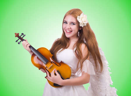 Young violin player isolated on whiteの写真素材