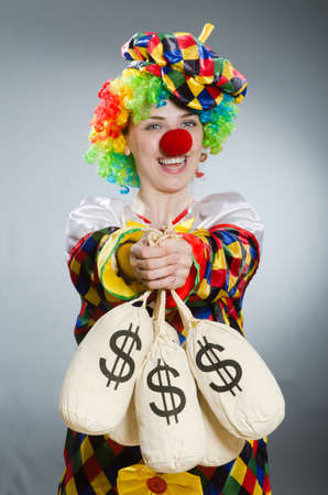 Clown with money bag in funny conceptの写真素材