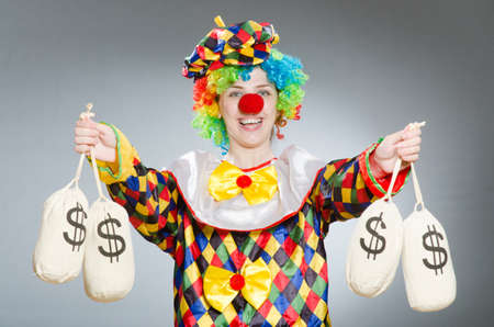 Clown with money bag in funny conceptの写真素材