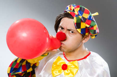 Clown with balloons in funny conceptの写真素材