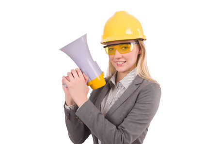 Female engineer in helmet with loudspeaker isolated on whiteの写真素材
