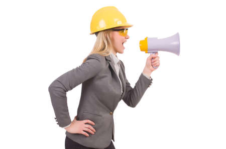 Female engineer in helmet with loudspeaker isolated on whiteの写真素材