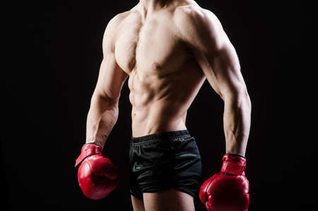 Muscular man in boxing conceptの写真素材