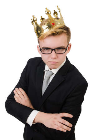 Young businessman with crown isolated on whiteの写真素材