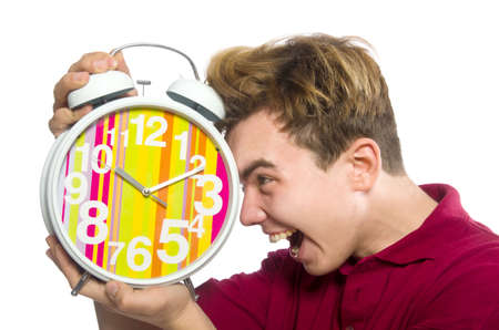 Student holding alarm clock isolated on whiteの写真素材
