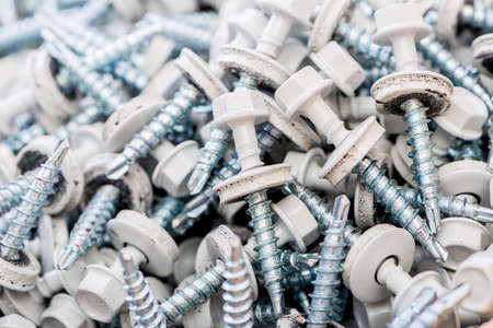 Many screws arranged as backgroundの写真素材