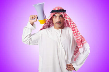 Arab man shouting through loudspeakerの写真素材