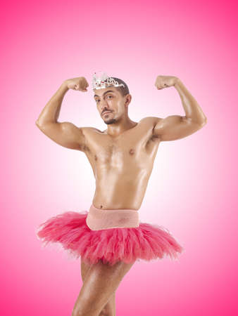 Man in ballet tutu against the gradientの写真素材