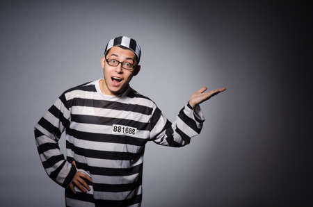 Young prisoner against grayの写真素材