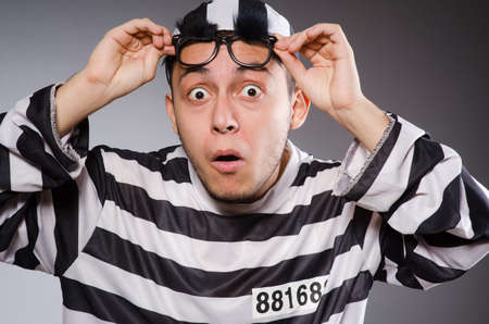 Young prisoner against grayの写真素材