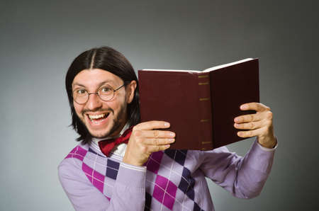 Young student with book in learning conceptの写真素材