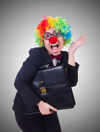 Woman clown businesswoman isolated on whiteの写真素材