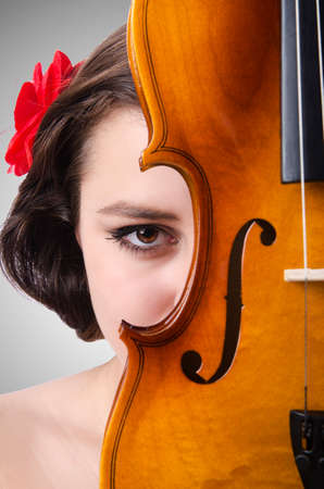 Young girl with violin on whiteの写真素材
