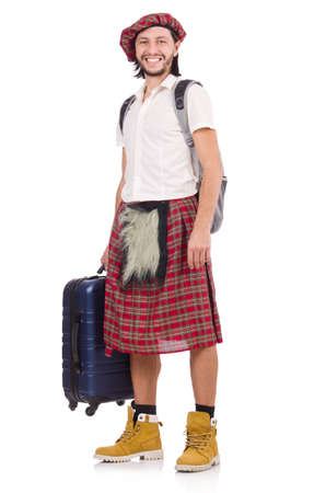 Man in scottish skirt with suitcase isolated on whiteの写真素材