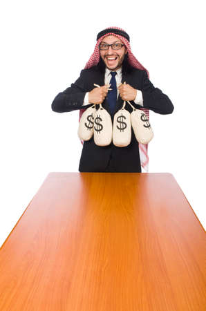 Arab businessman with sacks of moneyの写真素材