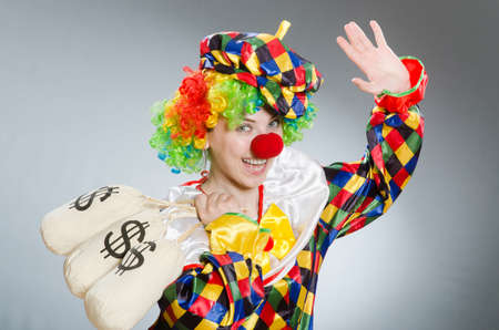 Clown with money bag in funny conceptの写真素材