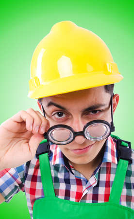 Funny construction worker isolated on whiteの写真素材