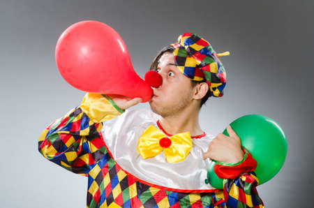 Clown with balloons in funny conceptの写真素材