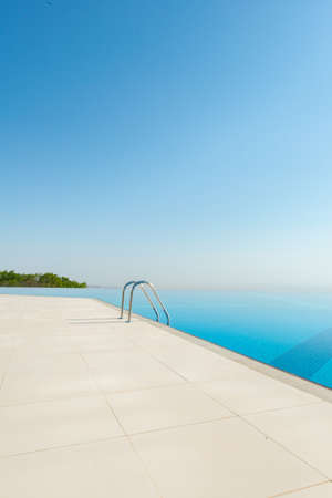 Infinity pool on the bright summer dayの写真素材
