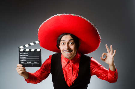 Mexican with movie board in funny conceptの写真素材