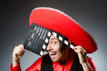 Mexican with movie board in funny conceptの写真素材