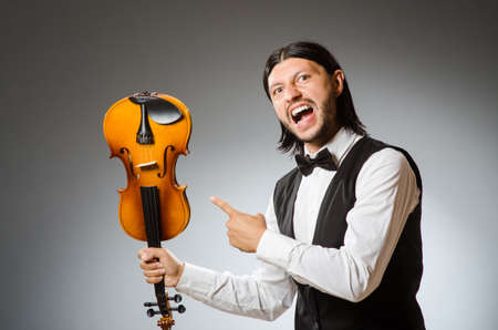Man playing violin in musical conceptの写真素材