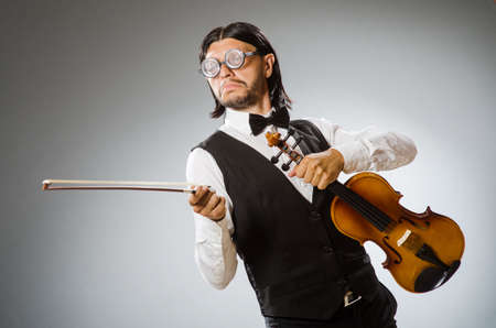 Man playing violin in musical conceptの写真素材