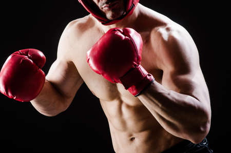 Muscular man in boxing concept