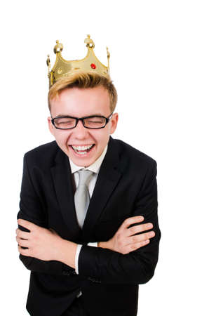 Young businessman with crown isolated on whiteの写真素材