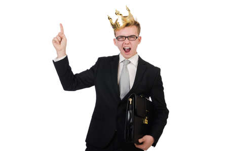 Young businessman with crown isolated on whiteの写真素材